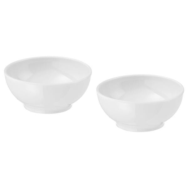 Two white porcelain bowls by ikea; simple, round shape; stackable design.
