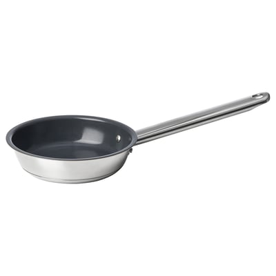 Stainless steel frying pan with black non-stick interior, round shape, and long handle.