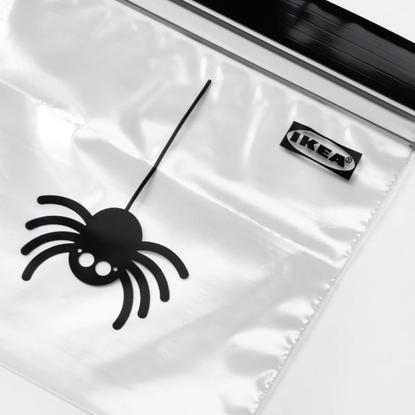 Clear plastic bag with black spider decoration. IKEA logo visible. Food safe, durable, and reusable.