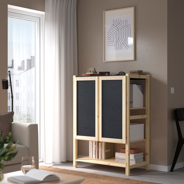 IVAR storage unit with adjustable shelves and doors in living space.