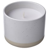 JÄMLIK candle: white ceramic, speckled, cylindrical with vanilla scent.