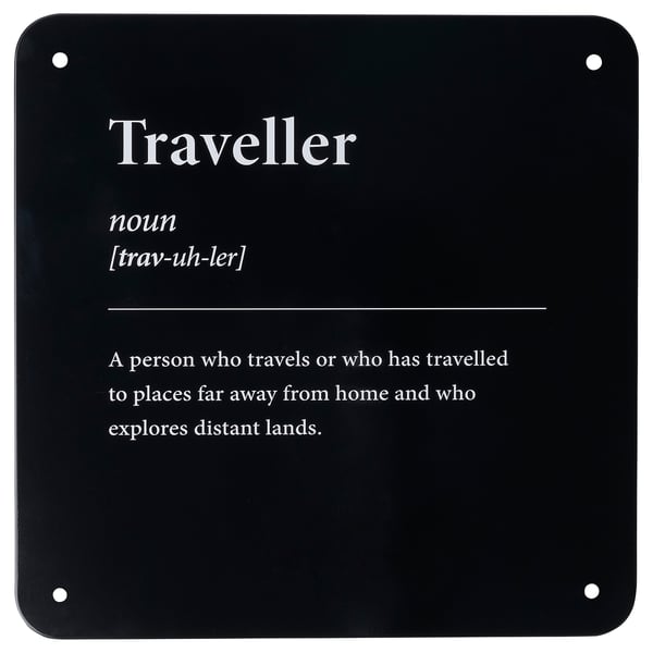 Displays a definition of traveller in white text on a black background. It provides the part of speech, pronunciation, and a brief description.