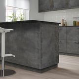 KALHYTTAN countertop: dark gray, large, rectangular, modern design, contrasts with white wall tiles.