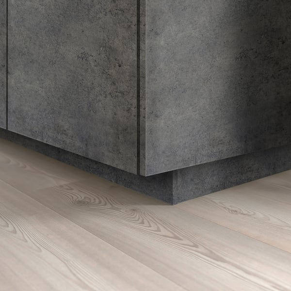 KALHYTTAN plinth covers gap between kitchen floor and base cabinets.