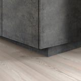 KALHYTTAN plinth covers gap between kitchen floor and base cabinets.