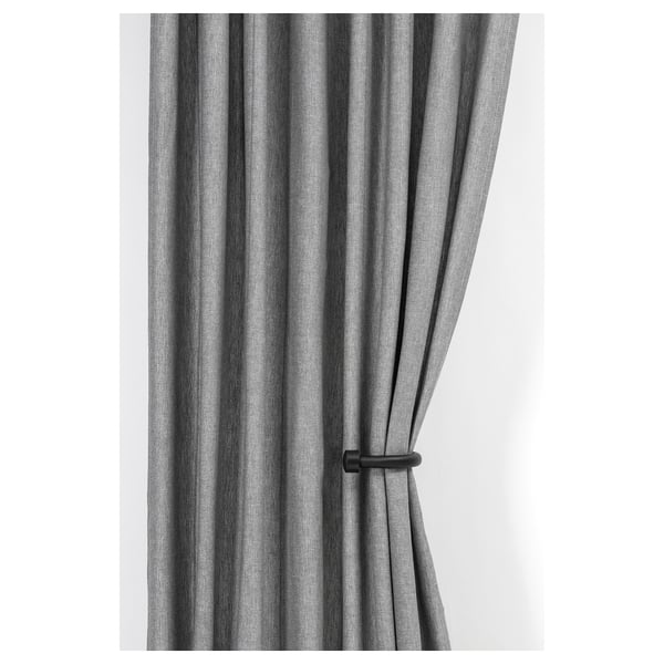Gray curtains tied back with black tie backs.