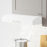 Kitchen hood with knobs above boiling stove.