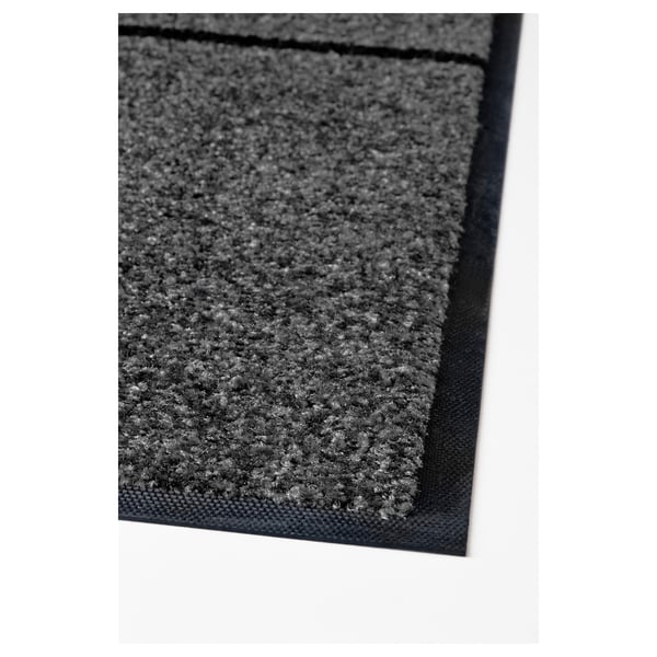 Grey textured doormat with black border and backing, quality material.