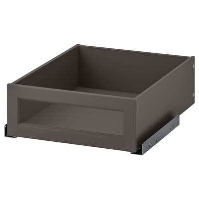 An open dark gray KOMPLEMENT framed glass drawer, part of a furniture line offering storage solutions, combining tempered glass and dark gray paint.