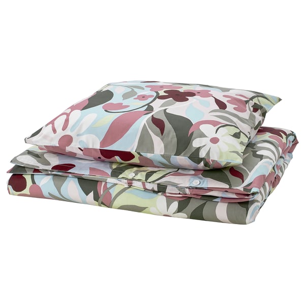 Folded floral bedding set with pink, blue, and green hues. Soft fabric, multi-colored floral design.