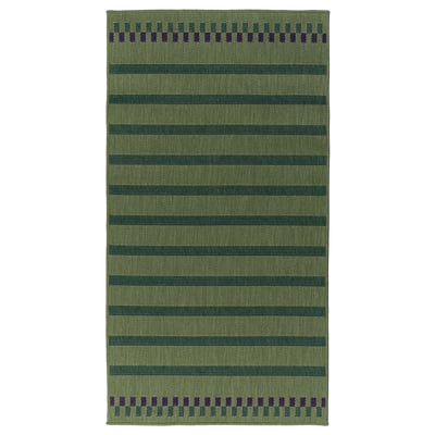 Green KORSNING rug with stripes and border, rectangular shape.