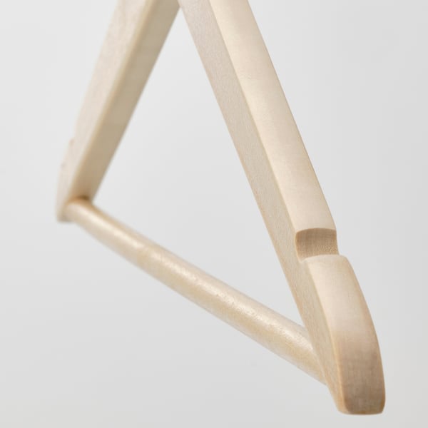 Gold-colored metal hanger with sleek, triangular design; sturdy, modern appeal.