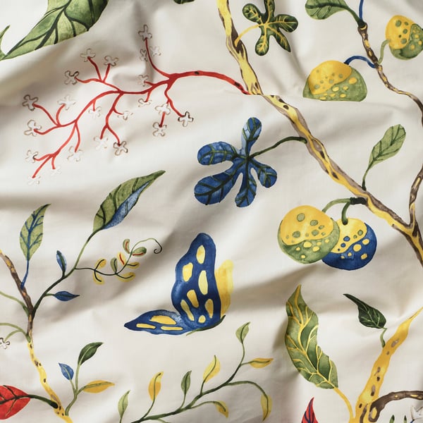 Vivid floral print on smooth, high-quality cotton-lyocell fitted sheet, featuring bright fruits, leaves, and butterflies.