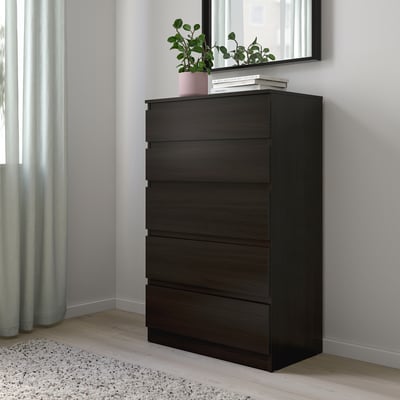 KULLEN chest with 5 drawers, wall-mounted, next to curtains, mirror with plant and books above.