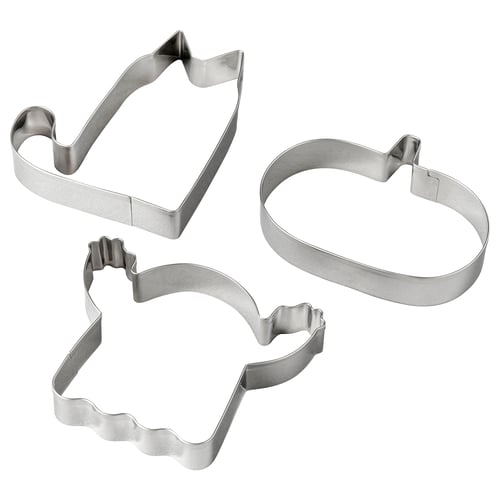 Three stainless steel cookie cutters: house, oval, wavy.