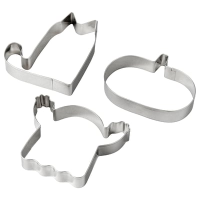 Three stainless steel cookie cutters: house, oval, wavy.