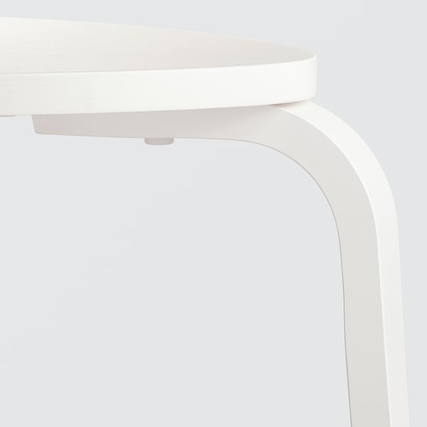 White wooden stool with curved legs and round seat, high-quality finish, neatly assembled.