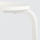 White wooden stool with curved legs and round seat, high-quality finish, neatly assembled.
