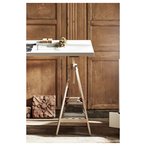 LAGKAPTEN table in white with metal trestle stand. Minimalist, modern design. Perfect for small spaces.