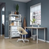 Home office: LAGKAPTEN desk, chair, bookshelf, plant, pen holder.