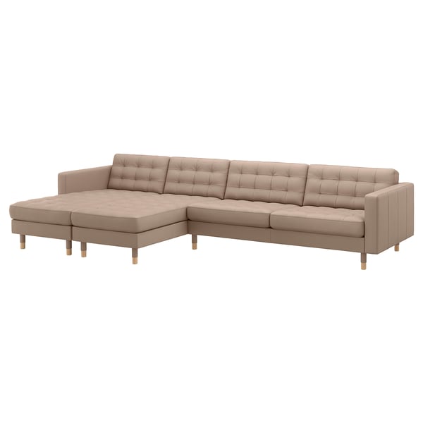 A beige IKEA lansåkrona sectional sofa. It has tufted leather seats, wooden legs, and a modern design.