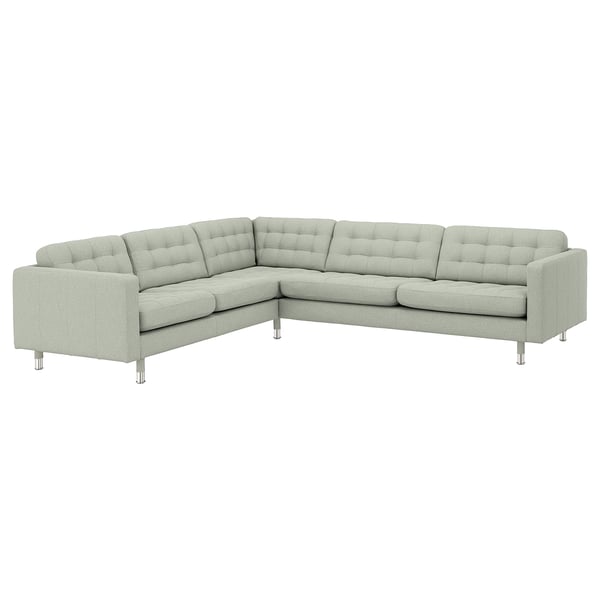Modern light grey corner sofa with tufted back, chrome legs, and clean lines.