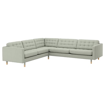 A light gray, modern l-shaped sectional sofa named LANDSKRONA with tufted cushions, wooden legs, and a 5-year warranty.
