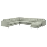 Light gray u-shaped sectional sofa with chrome legs, featuring tufted cushions and a modern design.
