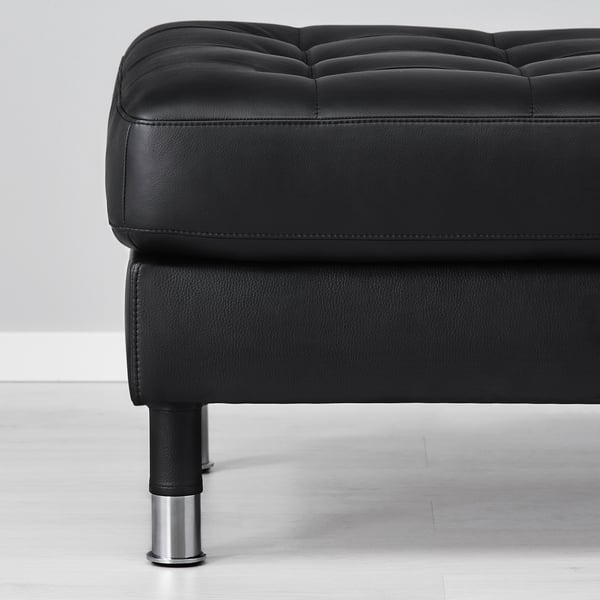 Black leather ottoman with chrome legs. Soft, smooth, high-quality upholstery. Designed for comfort and durability.