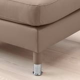 High-quality tan leather upholstered footstool on wooden floor, chrome leg detail.