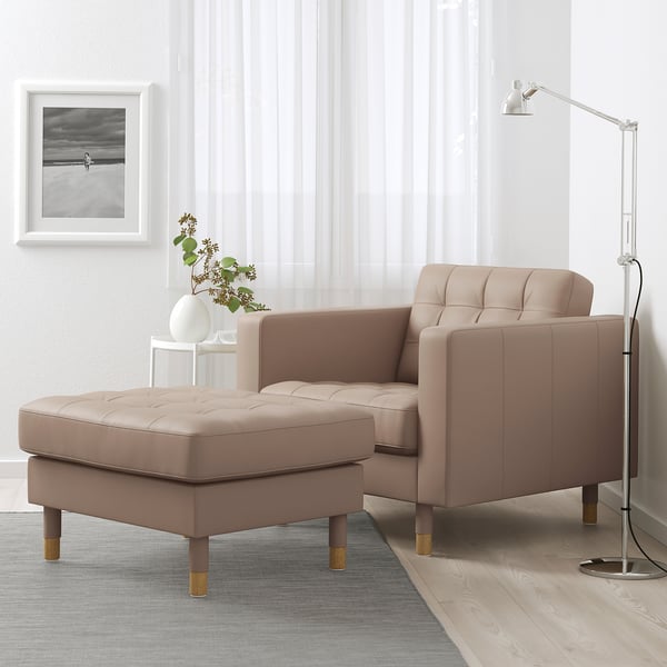 Modern living area with mid-century sofa, lamp, and rug.