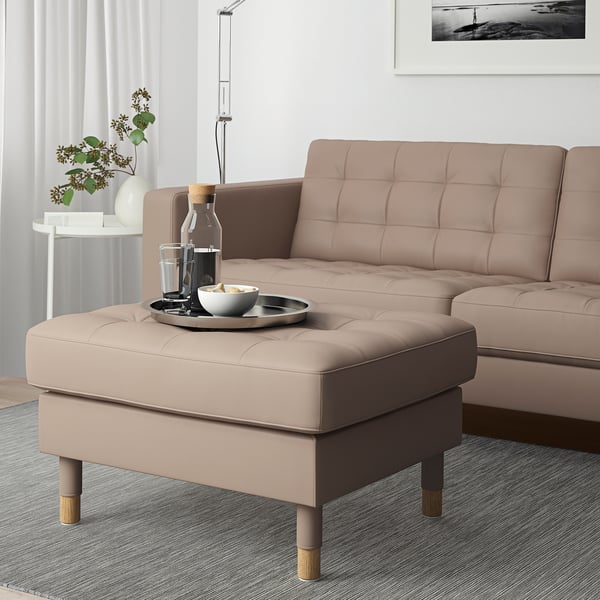LANDSKRONA footstool with tray and drinks, next to sofa.