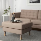 LANDSKRONA footstool with tray and drinks, next to sofa.