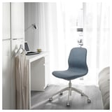 Modern blue office chair LÅNGFJÄLL near desk with laptop and tea.