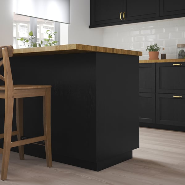 LERHYTTAN black kitchen island. Wooden top, dark base, medium-sized compared to cabinets, modern design.