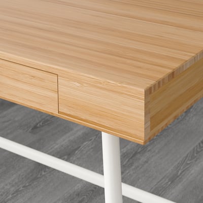 Wooden desk with built-in drawer, showcasing fine craftsmanship and quality bamboo material.