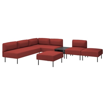 Red modular sofa set with corner and straight sections, two ottomans, and side table. Versatile.