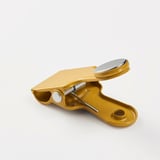 Yellow multi-use kitchen clip with magnet and metal spring. Suitable for sealing bags and attaching items to magnetic surfaces.