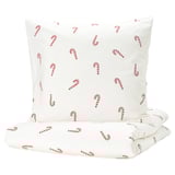 A white duvet set with red candy cane prints, made of soft cotton, perfect for a cozy and festive bedroom decor.