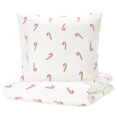 A white duvet set with red candy cane prints, made of soft cotton, perfect for a cozy and festive bedroom decor.