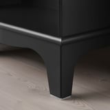 Dark wooden furniture with sleek, sturdy legs and smooth edges on a wood floor.
