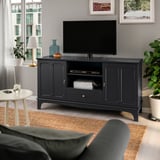 Modern grey LOMMARP tv stand in living room with decor and side table.