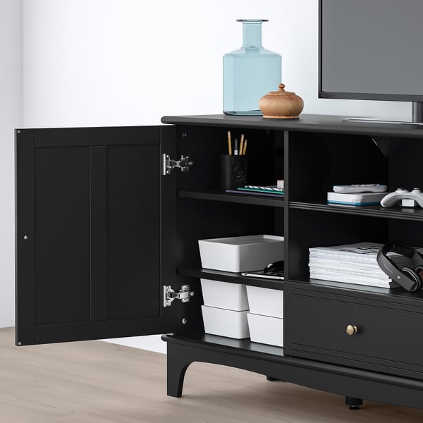 Black tv unit with open door revealing stackable white bins, part of the LOMMARP series.