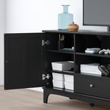 Black tv unit with open door revealing stackable white bins, part of the LOMMARP series.