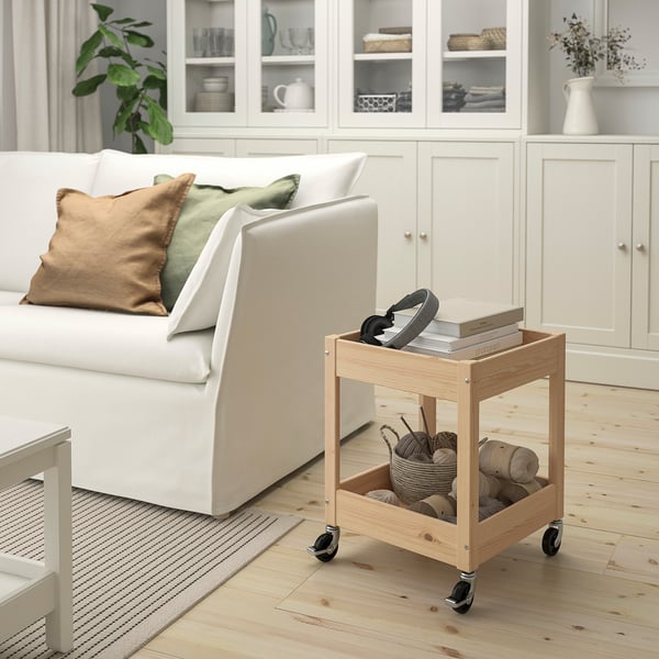 White LOSHULT trolley with wheels, holding headset, knitting supplies, fitting under couch.