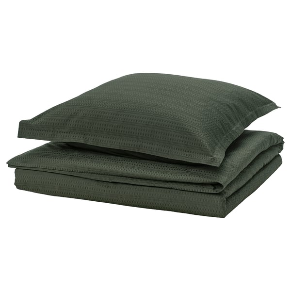 This image shows a dark green IKEA LUKTVICKER duvet set made of soft, recycled cotton with a textured waffle weave design.