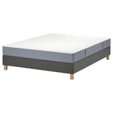 Image shows a grey lyngor mattress on a base with wooden legs.