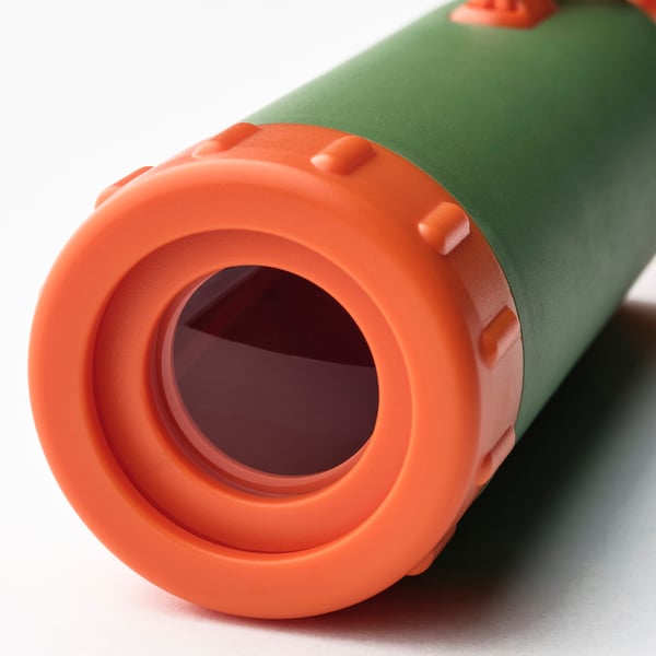 Close-up of green and orange telescope, focusing on lens. Durable build, textured grip.