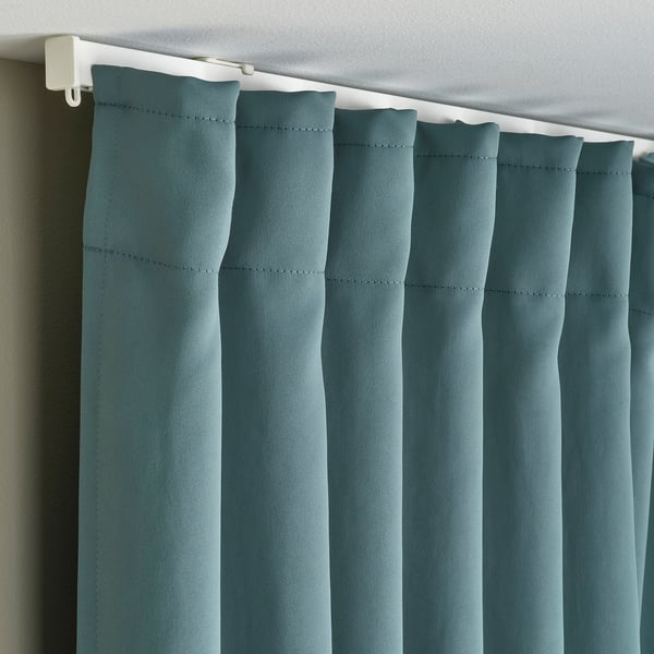 Darkening curtains with pleated folds for privacy and temperature control