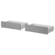 Two grey wooden storage drawers with caster wheels. Simple, rectangular design. Ideal for bed storage.